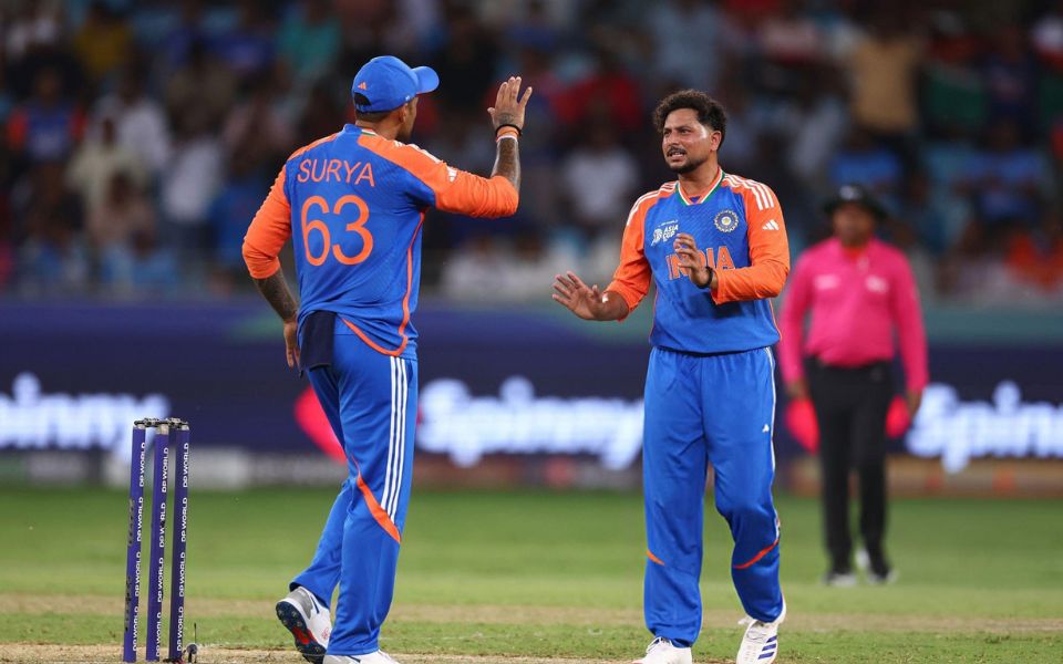 Asia Cup 2025, Match 2: Kuldeep Yadav [R] celebrates taking Muhammad Waseem's wicket with Suryakumar Yadav [L]