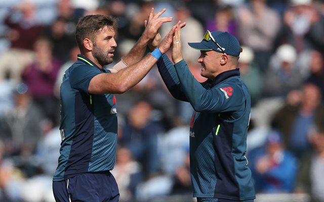 Liam Plunkett (L) and Jason Roy of England celebrate the wicket of Marcus Stoinis