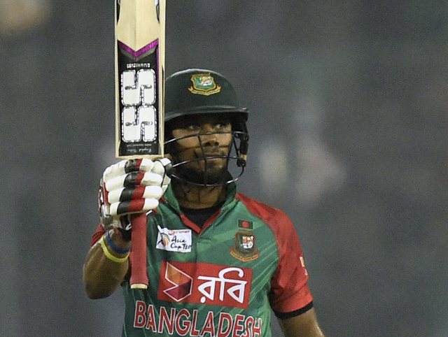 Sabbir Rahman acknowledges the crowd after half century