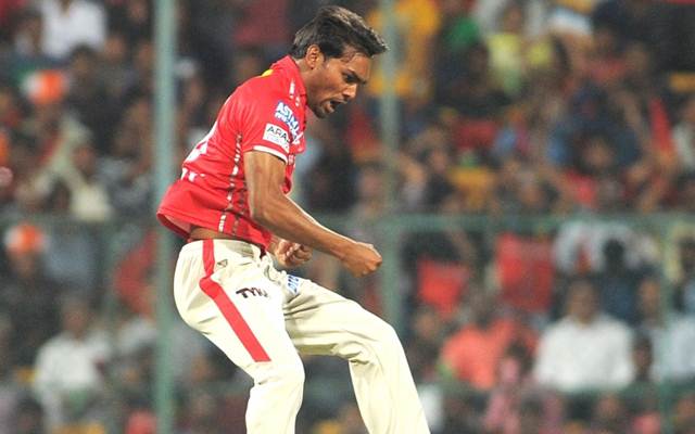 Kings XI Punjab player Sandeep Sharma celebrates fall of Virat Kohli's wicket