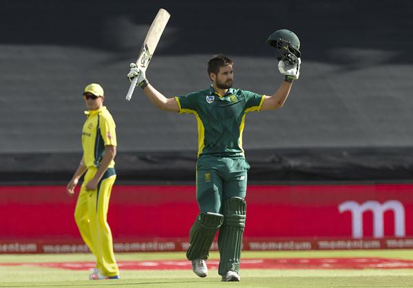 South Africa's Rilee Rossouw (R) acknowledges the crowd after scoring his century in the one Day International cricket match against Australia, on October 12, 2016, at Newlands Stadium, in Cape Town. South Africa won the toss and decided to bat in the fifth and final one-day international against Australia. / AFP / RODGER BOSCH (Photo credit should read RODGER BOSCH/AFP/Getty Images)