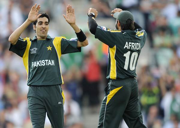 Pakistan's bowler Umer Gul (L) celebrates with teammate Shahid Afridi (R) after bowling Ireland's Trent Johnston for a duck during a ICC World Twenty20 super-eight match at the Oval in London June 15, 2009. Pakistan scored 159 runs for 5 wickets and won the game by 39 runs. (Photo by ADRIAN DENNIS/AFP/Getty Images)