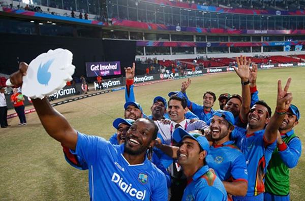 Winners Afghanistan get a selfie picture with Chris Gayle