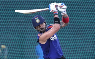 Virat Kohli signs autograph on net bowler's India jersey at Brabourne Stadium